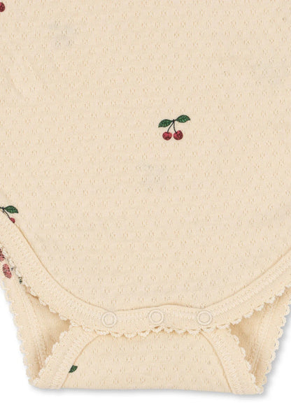 99.KS104004_CHERRY # Baby romper with ruffles CHERRY
